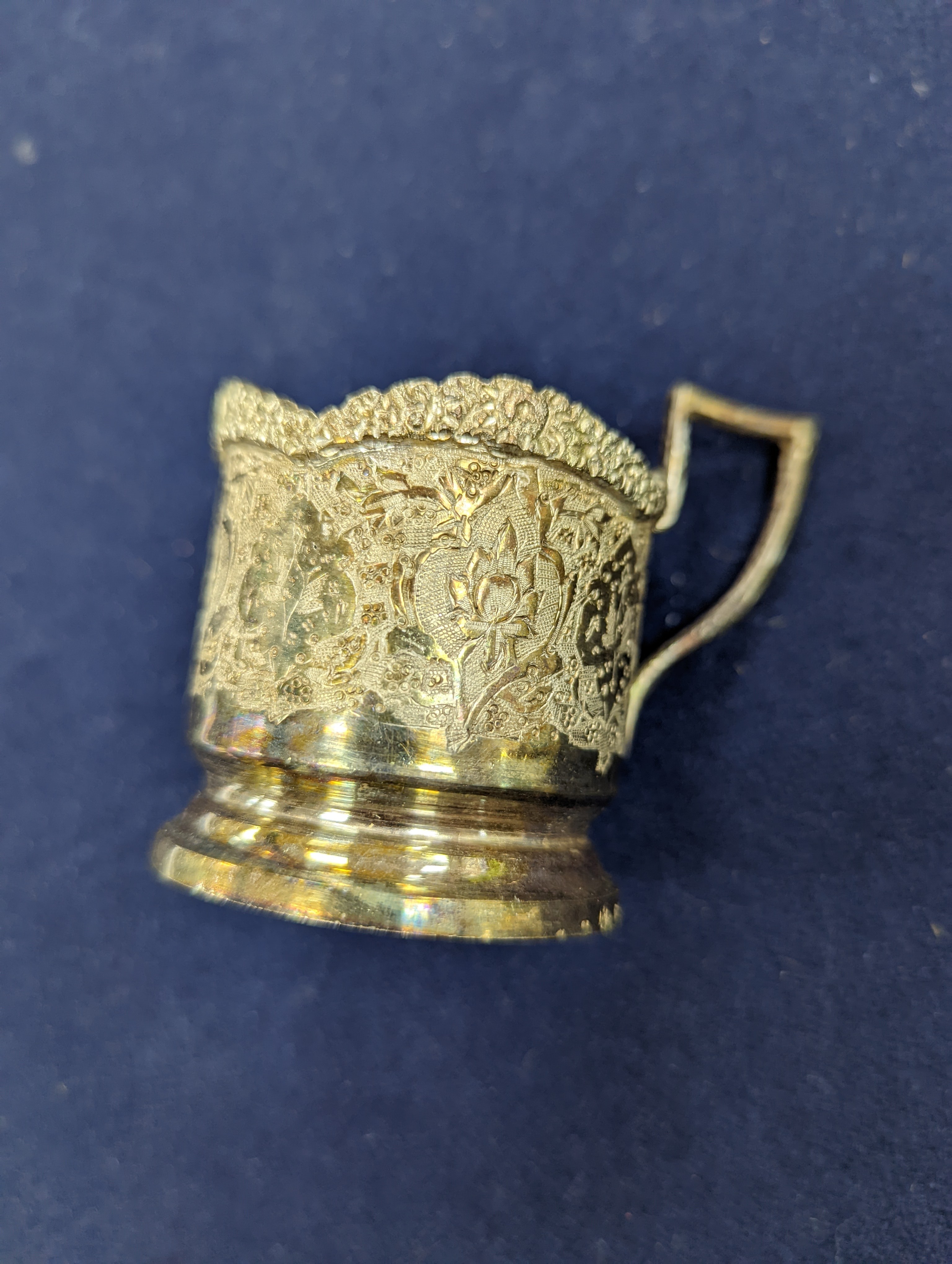 A set of six Persian embossed 84 standard white metal coffee cup holders and matching sugar bowl and cover by Vartan and four other Persian white metal items.